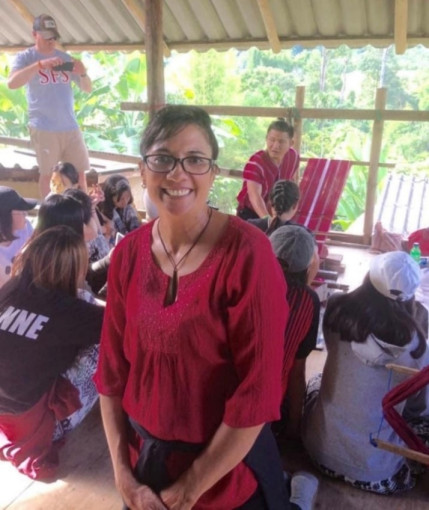 Thalea volunteering in a hill tribe village with visiting students from Singapore.